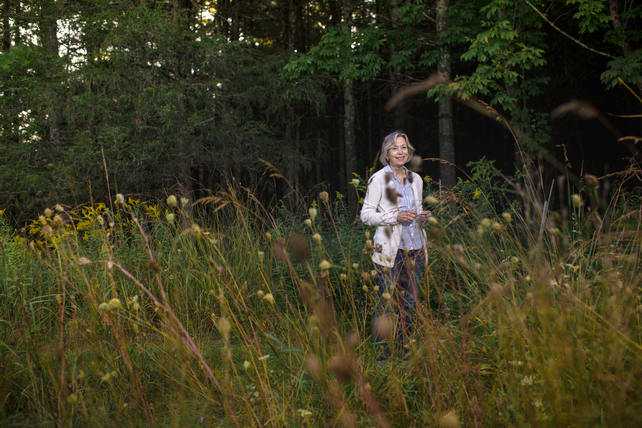 Page Dickey standing in a field.